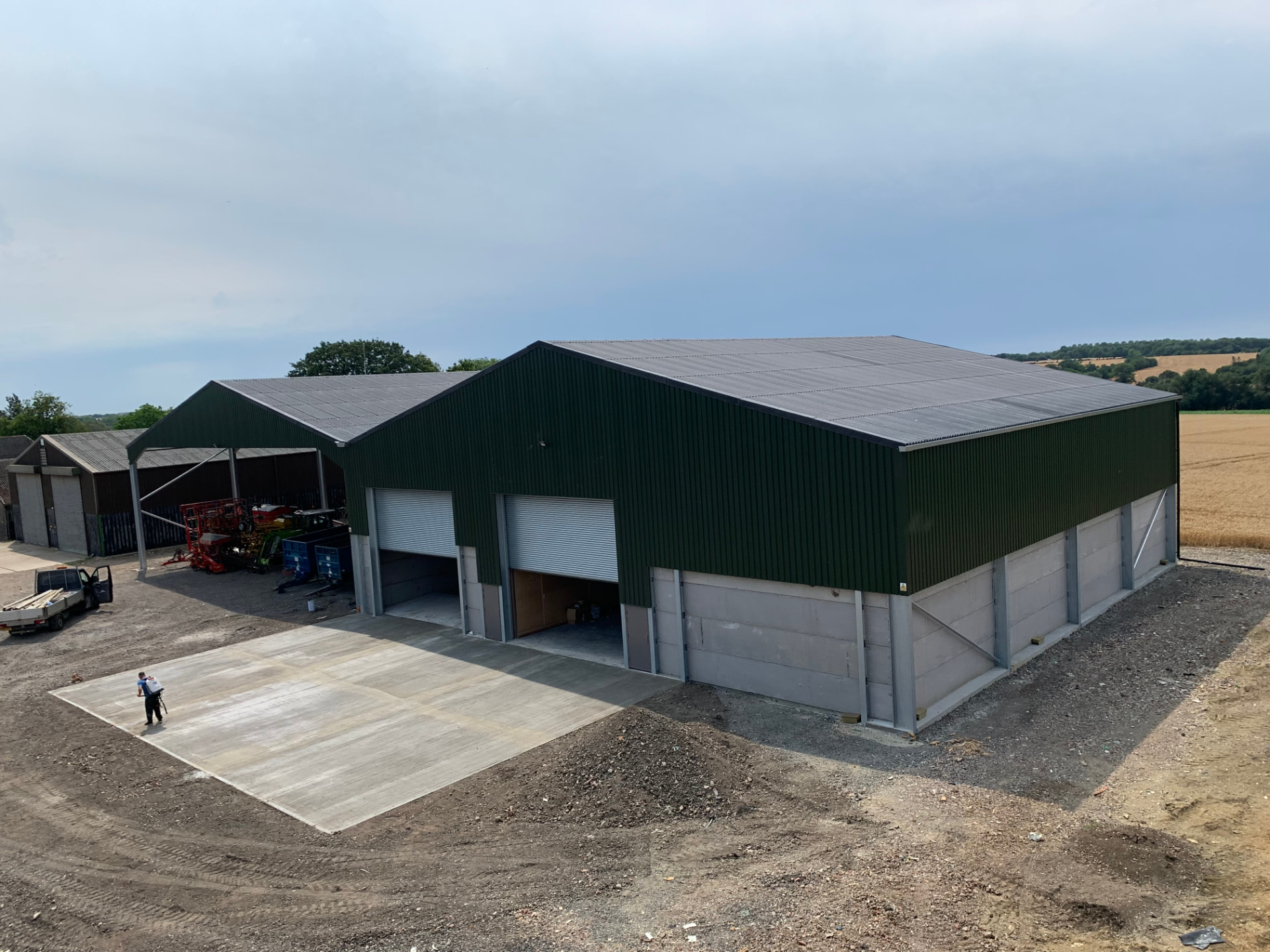 Completed grain store building with concrete panel walls and steel frame