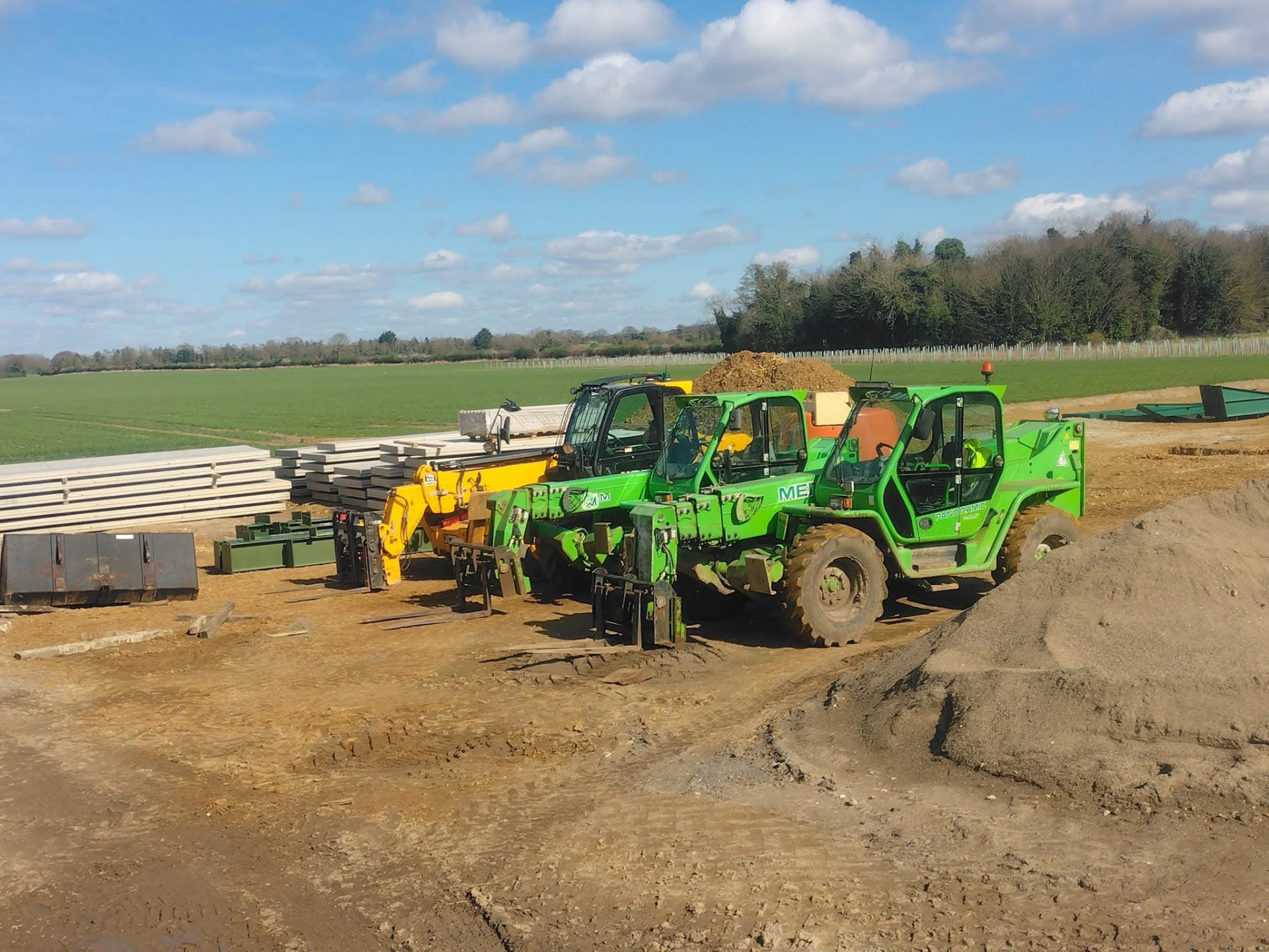 Construction plant and concrete panels on a prepared agricultural site